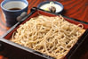 Buckwheat noodles served on a bamboo strainer