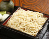 Buckwheat noodles served on a bamboo strainer