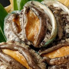 Grilled live abalone