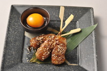 Meatballs served with egg yolk