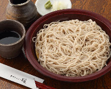 Buckwheat noodles served on a bamboo strainer