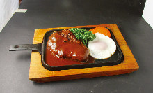 Hamburg steak topped with an egg sunny-side up