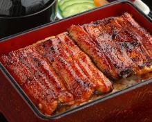 Premium eel served over rice in a lacquered box