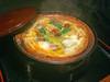Pot of loaches boiled in soy sauce with eggs and burdock