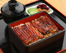 Premium eel served over rice in a lacquered box