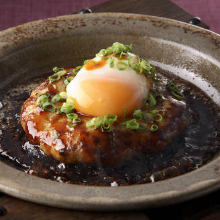 Meatballs served with egg yolk