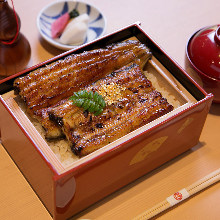 Premium eel served over rice in a lacquered box