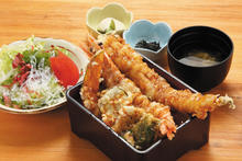 Tempura served over rice in a lacquered box