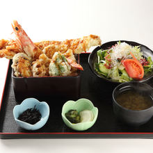 Tempura served over rice in a lacquered box