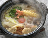 Wheat noodles boiled in a ceramic pot