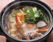 Wheat noodles boiled in a ceramic pot