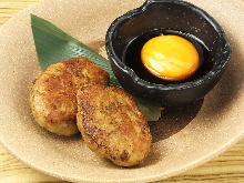 Meatballs served with egg yolk