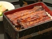 Premium eel served over rice in a lacquered box