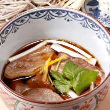 Buckwheat noodles served on a bamboo strainer with duck