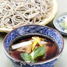 Buckwheat noodles served on a bamboo strainer with duck