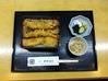 Tempura served over rice in a lacquered box