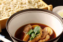 Buckwheat noodles served on a bamboo strainer with duck