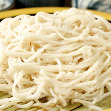 Buckwheat noodles served on a bamboo strainer