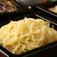 Buckwheat noodles served on a bamboo strainer