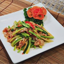 Stir-fried pork and garlic scapes