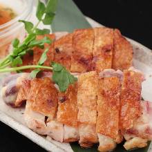 Grilled locally raised chicken thigh seasoned with yuzu pepper