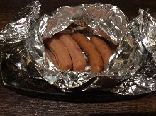 Grilled sausages in foil