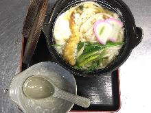 Wheat noodles boiled in a ceramic pot