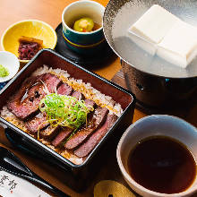 Wagyu beef steak in a lacquered box, with boiled tofu