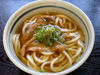 Udon Noodles topped with deep-fried tofu pockets