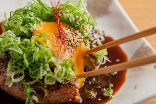 Meatballs served with egg yolk