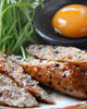 Meatballs served with egg yolk