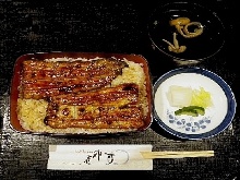 Premium eel served over rice in a lacquered box