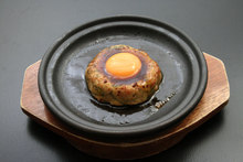 Meatballs served with egg yolk