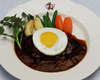 Hamburg steak topped with an egg sunny-side up