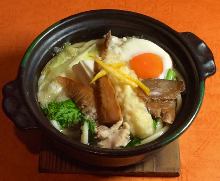 Wheat noodles boiled in a ceramic pot