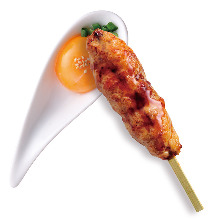 Grilled meatball skewer with egg yolk