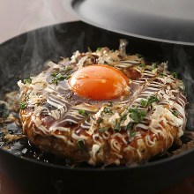 Meatballs served with egg yolk