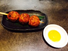 Meatballs served with egg yolk