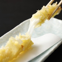 Deep-fried mozzarella cheese in broth