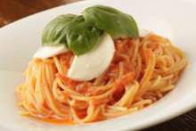 Pasta with tomato sauce, mozzarella, and basil