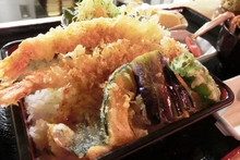 Tempura served over rice in a lacquered box