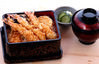 Tempura served over rice in a lacquered box