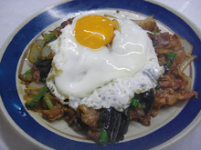 Stir-fried pork and garlic scapes