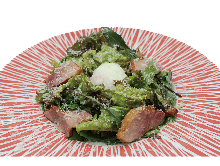 Caesar salad with soft-boiled egg and bacon