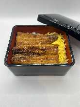 Extra premium eel served over rice in a lacquered box