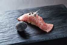 Seared wagyu beef sushi with truffle garnish