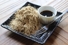 Warabimochi (bracken-starch dumpling covered in sweet, toasted soybean flour)
