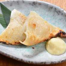 Charcoal-seared ray fin