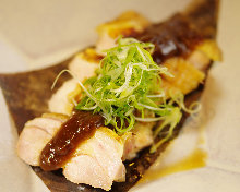 Jidori chicken and miso grilled on a magnolia leaf