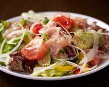 Tomato and raw ham salad